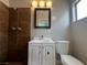 Clean bathroom with white vanity, tiled shower, and modern fixtures at 1338 Smoke Tree Ave, Las Vegas, NV 89108