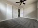 Bedroom features new carpet, ceiling fan, and neutral walls for a bright, inviting space at 1338 Smoke Tree Ave, Las Vegas, NV 89108