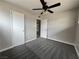 A bedroom featuring new carpet, a ceiling fan, and neutral walls for a bright space at 1338 Smoke Tree Ave, Las Vegas, NV 89108