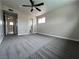 Comfortable bedroom featuring soft carpet, ceiling fan, and natural light at 1338 Smoke Tree Ave, Las Vegas, NV 89108