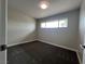 Bedroom featuring new carpet, a window with view, and neutral paint at 1338 Smoke Tree Ave, Las Vegas, NV 89108