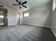 Inviting bedroom with neutral carpet, ceiling fan, and closet at 1338 Smoke Tree Ave, Las Vegas, NV 89108