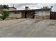 A single story home with a rock facade and driveway at 1338 Smoke Tree Ave, Las Vegas, NV 89108