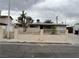 Charming single-story home with a well-maintained front yard and a decorative fence at 1338 Smoke Tree Ave, Las Vegas, NV 89108