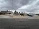 Traditional home with a large front yard, mature tree, and a partially fenced yard at 1338 Smoke Tree Ave, Las Vegas, NV 89108
