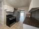 Traditional kitchen featuring stainless steel appliances, granite counters and white cabinets at 1338 Smoke Tree Ave, Las Vegas, NV 89108