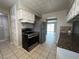 Traditional kitchen featuring stainless steel appliances, granite counters and white cabinets at 1338 Smoke Tree Ave, Las Vegas, NV 89108