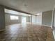 Open-concept living area featuring tile flooring and natural light at 1338 Smoke Tree Ave, Las Vegas, NV 89108