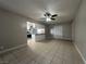 Open living space with a ceiling fan and tile flooring at 1338 Smoke Tree Ave, Las Vegas, NV 89108