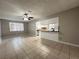 Open living space with a view of the kitchen and a ceiling fan for added comfort at 1338 Smoke Tree Ave, Las Vegas, NV 89108