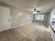 Open living space with a ceiling fan and tile flooring at 1338 Smoke Tree Ave, Las Vegas, NV 89108