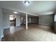 Bright living room showcasing tile flooring and modern lighting at 1338 Smoke Tree Ave, Las Vegas, NV 89108