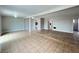 Large open living space with tile flooring and access to other rooms at 1338 Smoke Tree Ave, Las Vegas, NV 89108