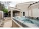 Backyard area featuring a luxurious hot tub and covered patio at 1598 Cowboy Chaps Pl, Henderson, NV 89002