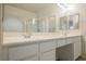 Bathroom featuring double sinks, a large mirror, and separate glass shower at 1598 Cowboy Chaps Pl, Henderson, NV 89002
