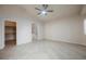 Bedroom featuring tile flooring, ceiling fan, and en-suite access to the bathroom and walk-in closet at 1598 Cowboy Chaps Pl, Henderson, NV 89002