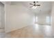 Bright bedroom offers tiled floors, a ceiling fan, and plenty of natural light from multiple windows at 1598 Cowboy Chaps Pl, Henderson, NV 89002
