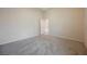 Bedroom with neutral carpet and attached bathroom with an open door at 1598 Cowboy Chaps Pl, Henderson, NV 89002