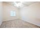 Neutral bedroom with gray carpet, white trim, and ceiling fan at 1598 Cowboy Chaps Pl, Henderson, NV 89002