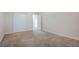 Carpeted bedroom featuring a sliding door closet and a doorway at 1598 Cowboy Chaps Pl, Henderson, NV 89002