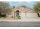 Inviting single-story home with a beautifully landscaped yard and a spacious driveway at 1598 Cowboy Chaps Pl, Henderson, NV 89002