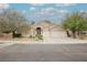 Charming single-story home features a well-manicured yard and a three-car garage at 1598 Cowboy Chaps Pl, Henderson, NV 89002