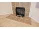 Stone fireplace with decorative iron screen, and tile hearth at 1598 Cowboy Chaps Pl, Henderson, NV 89002