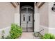 A wrought iron gate guards the front door of this home at 1598 Cowboy Chaps Pl, Henderson, NV 89002