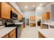 Bright kitchen featuring stainless appliances, gas range, and lots of cabinet space at 1598 Cowboy Chaps Pl, Henderson, NV 89002