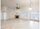 Bright living room with tile flooring, fireplace, ceiling fan and natural lighting at 1598 Cowboy Chaps Pl, Henderson, NV 89002