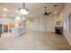 Open-concept living room featuring a fireplace, fan, and tile flooring throughout at 1598 Cowboy Chaps Pl, Henderson, NV 89002