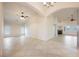 Spacious living room featuring tiled floors, ceiling fans, and natural light, perfect for entertaining at 1598 Cowboy Chaps Pl, Henderson, NV 89002