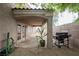 Covered outdoor kitchen area with a built-in grill, perfect for summer barbecues and entertaining at 1598 Cowboy Chaps Pl, Henderson, NV 89002