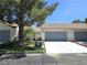 Inviting single story home featuring a charming desert landscape, covered front porch, and an attached two-car garage at 2253 Van Gogh Dr, Henderson, NV 89074