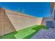 Compact backyard space features brick paver patio and artificial grass at 2523 Campaldo St, Henderson, NV 89044