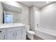 Modern bathroom boasts double vanity, large mirror, and tiled shower/tub at 2523 Campaldo St, Henderson, NV 89044