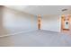 Large bedroom featuring neutral carpeting, access to hallway and spacious closet at 2523 Campaldo St, Henderson, NV 89044