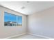 Empty bedroom with large window offering view of clear, blue sky at 2523 Campaldo St, Henderson, NV 89044