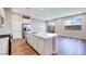 Bright, open kitchen with white cabinetry, stainless appliances, and a large island at 2523 Campaldo St, Henderson, NV 89044