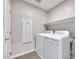 Bright laundry room with storage shelf and modern washer and dryer at 2523 Campaldo St, Henderson, NV 89044