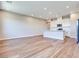 Open-concept kitchen and living room with hardwood floors and recessed lighting at 2523 Campaldo St, Henderson, NV 89044