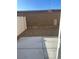 A simple backyard with a concrete patio and a gravel area surrounded by fencing at 2755 Atomic Tangerine Way # 2, Las Vegas, NV 89183