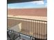 A balcony with iron railings offering a view of the desert landscape at 2755 Atomic Tangerine Way # 2, Las Vegas, NV 89183