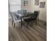 Formal dining room featuring a wooden table, six chairs, and modern decor at 2755 Atomic Tangerine Way # 2, Las Vegas, NV 89183