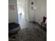 Hallway with gray floors, bench, floor lamp, and dog accessories at 2755 Atomic Tangerine Way # 2, Las Vegas, NV 89183