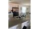 Modern kitchen featuring a stone countertop, white cabinets, and stainless-steel appliances at 2755 Atomic Tangerine Way # 2, Las Vegas, NV 89183