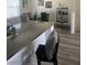 A bright kitchen featuring modern countertops and a view of the dining area at 2755 Atomic Tangerine Way # 2, Las Vegas, NV 89183