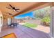 Covered back patio with ceiling fans and outdoor dining set, perfect for entertaining guests or relaxing at 3001 Walnut Park Ct, Henderson, NV 89052