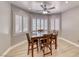 This breakfast nook features a wood table, wooden chairs, and plantation shutters at 3001 Walnut Park Ct, Henderson, NV 89052