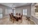 This dining room features a wood table, leather chairs, plantation shutters, and light walls at 3001 Walnut Park Ct, Henderson, NV 89052